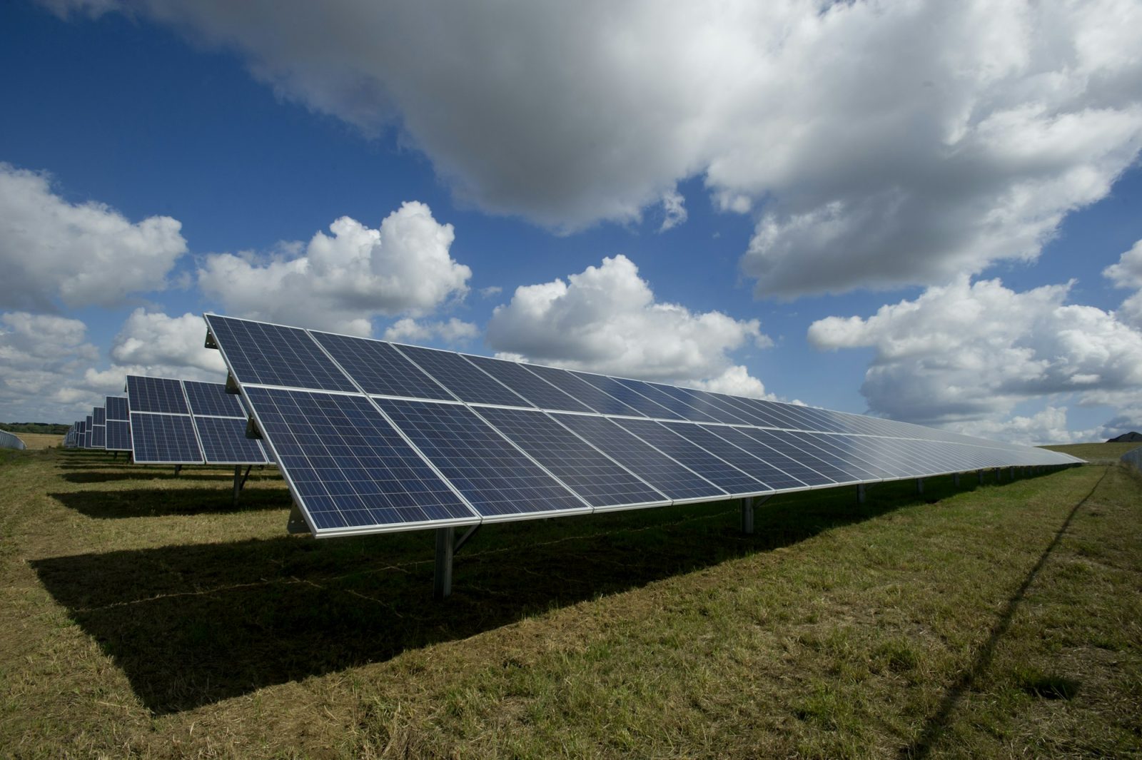 Illustrative photograph of a ground-mounted solar array in daylight. This is not a Maspro Energy project.